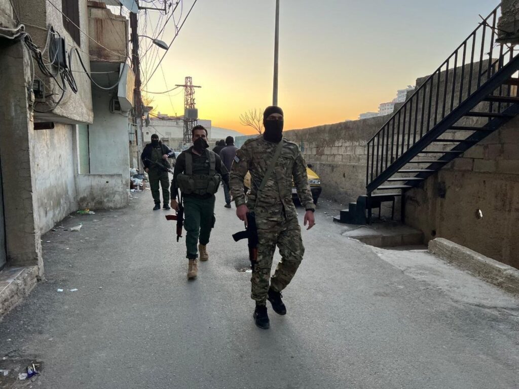 A photo circulated on social media in February 2025 shows members of Hay’at Tahrir al-Sham in the al-Ward neighborhood of Damascus.