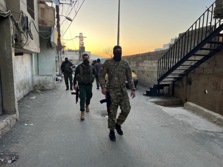 Armed Attack Targeting the Alawite Community in Al-Ward Neighborhood Rural Damascus A photo circulated on social media in February 2025 shows members of Hay’at Tahrir al-Sham in the al-Ward neighborhood of Damascus.
